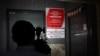 FILE - A cameraman takes visuals outside the office of Maiden Pharmaceuticals Ltd. company, in New Delhi, India, Oct. 6, 2022. 