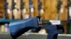 FILE - A bump stock that attaches to a semiautomatic rifle to increase the firing rate is seen at Good Guys Gun Shop in Orem, Utah, Oct. 4, 2017. 