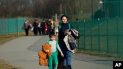 Ukrajinske izbeglice u Poljskoj (Foto: AP/Sergei Grits)