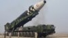 Rudal balistik antarbenua (ICBM) "Hwasong-17" pada kendaraan peluncurannya dalam foto tak bertanggal yang dirilis 25 Maret 2022 oleh Kantor Berita Pusat Korea (KCNA) Korea Utara. (KCNA via REUTERS)
