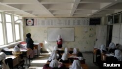 FILE - The Taliban have extended their ban on secondary schools for girls. Only younger girls, like these photographed on Oct. 26, 2021, may attend primary school.