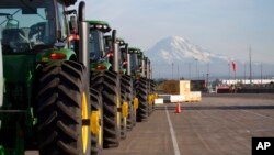 FILE - John Deere tractors are shown as they are readied for export to Asia in Tacoma, Wash., Nov. 4, 2019. U.S. President Joe Biden will unveil his administration's long-awaited Indo-Pacific Economic Framework on May 23, 2022, in Japan.