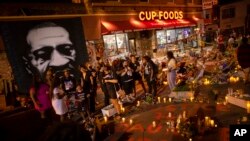 FILE - The family of Daunte Wright gathers on the one-year anniversary of George Floyd's death, May 25, 2021, in Minneapolis. 