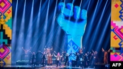 FILE - Ukrainian band Kalush Orchestra performs on stage during the 2022 MTV Europe Music Awards in Düsseldorf, Germany, Nov. 13, 2022.