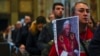 Mourners queue inside St. Peter's Basilica at the Vatican to see Pope Emeritus Benedict XVI lying in state, Jan. 4, 2023.
