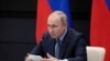FILE - Russian President Vladimir Putin chairs a meeting with leadership of military-industrial complex enterprises in Tula, Russia, Dec. 23, 2022. (Sputnik/Russian Presidential Press Office/Kremlin via Reuters) 