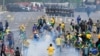 FILE - Protesters, supporters of former President Jair Bolsonaro, clash with police during a protest outside the Planalto Palace building in Brasilia, Brazil, Jan. 8, 2023. 