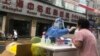 In Shanghai, Leaving Home for Testing Means COVID Exposure