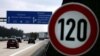 FILE - Cars pass a 120 km/h (75 mph) speed limit sign on the A27 Autobahn near Bremen, Germany, April 10, 2008. A study published in January 2023 found that Germany could save almost three times more carbon dioxide emissions than previously thought with a speed limit on highways.