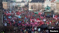Demonstrators take part in a protest against the government's proposal to abolish a public holiday to help finance the defense budget, in front of the Danish Parliament in Copenhagen, Feb. 5, 2023. (The Ritzau Scanpix/Emil Helms via Reuters) 