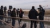 FILE - Journalists gather after a commercial airplane made an emergency landing in Barcelona's El Prat airport, Spain, Dec. 7, 2022. Finnish, Norwegian, Danish and Icelandic unions will quit a global media federation, Jan. 31, 2023, in protest at "corruptive activity."