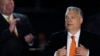 FILE - Hungary's Prime Minister Viktor Orban acknowledges cheering supporters during an election night rally in Budapest, Hungary, April 3, 2022. 
