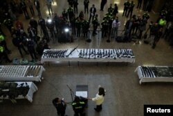 An arsenal of seized weapons that authorities say belonged to dissidents of the Revolutionary Armed Forces of Colombia (FARC) is shown at a press conference in Bogota, Colombia, Jan. 16, 2023