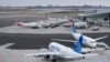 Planes sit on the tarmac at Terminal B at LaGuardia Airport in New York, Jan. 11, 2023. 