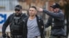 Solomon Pena, a Republican candidate for New Mexico House District 14, is taken into custody by Albuquerque Police officers, Jan. 16, 2023, in southwest Albuquerque, N.M. 