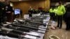 Rifles are seen during a news conference that showed the seizure of weapons, explosives and ammunition, authorities say belonged to dissidents of the Revolutionary Armed Forces of Colombia (FARC), in Bogota, Colombia, Jan. 16, 2023. 