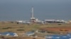 The drilling rig of the Kingfisher oil field, operated by China National Offshore Oil Corporation (CNOOC), is seen on the shores of Lake Albert in the Kikuube district of western Uganda, Jan. 24, 2023. 