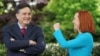 FILE: White House chief of staff Ron Klain and press secretary Jen Psaki in the Rose Garden of the White House in Washington, May 13, 2021. 
