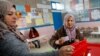 A voter prepares to cast her ballot at a polling station during the second round of the parliamentary election in Tunis, Jan. 29, 2023.