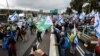 Israeli military reservists block the main highway from Jerusalem to Tel Aviv as they demonstrate against proposed judicial reforms by Israel's new right-wing government in Shoresh near Jerusalem, Feb. 9, 2023. 