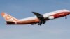FILE - A Boeing 747-8 takes its first flight, March 20, 2011, at Paine Field in Everett, Wash. After more than half a century, Boeing is rolling its last 747 out of a Washington state factory on Tuesday night. 