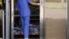 FILE - Corpses are seen at a hospital’s bereavement room, as COVID-19 cases surge in Hong Kong, China, March 3, 2022.