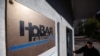 FILE - Russian investigative newspaper Novaya Gazeta's plate is seen next to an entrance to the office in Moscow, Oct. 8, 2021.