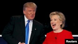 FILE - Republican U.S. presidential nominee Donald Trump shakes hands with Democratic U.S. presidential nominee Hillary Clinton at the conclusion of their first presidential debate at Hofstra University in Hempstead, New York, Sept. 26, 2016.