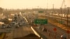 FILE - Cars and trucks roll along a section of Highway 99 during rush hour in Fresno, Calif., June 23, 2017. California's vast San Joaquin Valley has long been burdened by some of the nation's dirtiest air. 