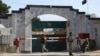FILE - Security stands guard outside the Pakistan Embassy in Kabul, Afghanistan, Nov. 4, 2019.