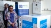 FILE - Uganda's Minister of Health Jane Ruth Aceng receives boxes containing one of three candidate vaccines against the Sudan strain of the Ebola virus, in Entebbe, Uganda, Dec. 8, 2022. 