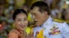 FILE - Thai King Maha Vajiralongkorn speaks with Princess Bajrakitiyabha while meeting supporters in Bangkok, Thailand, Nov. 1, 2020. 
