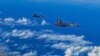 In this photo released by Xinhua News Agency, fighter jets of the Eastern Theater Command of the Chinese People's Liberation Army conduct a joint combat training exercises around the Taiwan Island, Aug. 7, 2022. (Gong Yulong/Xinhua via AP)