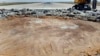 FILE - This photo released by the Syrian official news agency SANA, shows a bulldozer working on a damaged runway of the Damascus International Airport, after it was hit by an Israeli airstrike, in Damascus, Syria, June 12, 2022.