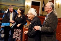 Four Directions co-founder O.J. Semans, right, and Marcella LeBeau, whose ancestor died at Wounded Knee, June 25, 2019,