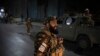 Taliban fighters block roads after an explosion Tuesday, Nov. 2, 2021. An explosion went off Tuesday at the entrance of a military hospital in Kabul, killing several people and wounding over a dozen, health officials said.