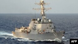 In this 2008 image released by the US Navy, the guided-missile destroyer USS Mason steams through the Atlantic Ocean. The ship responded after a missile fired by Yemen's Iran-backed Houthi rebels struck a Norwegian-flagged tanker off Yemen on Monday, US Central Command said.