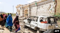 FILE - A governor in Somalia has announced rewards of up to $25,000 for anyone who kills an Islamist militant with the al-Shabab terrorist group, which set off an explosion that destroyed the house and car in this photo taken in Mogadishu, Somalia, Feb. 16, 2022. 