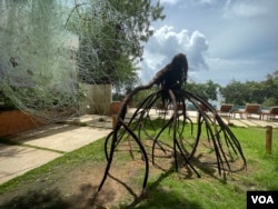 A sculpture by artist Fabrice Monteiro at Oceanium in Dakar, Senegal seeks to raise awareness of the importance of protecting marine environments. (Annika Hammerschlag/VOA)