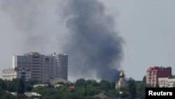 Smoke rises after shelling during the Ukraine-Russia conflict in Donetsk, Ukraine, July 6, 2022. 