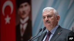 Turkey's Prime Minister Binali Yildirim speak to the country's security chiefs in Ankara, Jan. 18, 2018. 