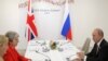 May Tells Putin Russia Must End Irresponsible Activity