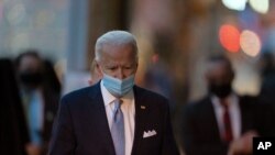 President-elect Joe Biden walks to speak to the media as he leaves The Queen theater, Nov. 24, 2020, in Wilmington, Del.