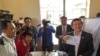 Opposition Leader Ventures Out of Hiding to Register to Vote