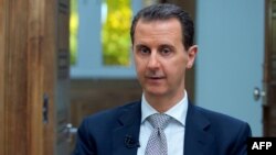 Presiden Suriah Bashar al-Assad dalam wawancara dengan AFP di Damaskus, Rabu (12/4). 