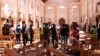 Sri Lankan security personnel walk through debris following an explosion in St Sebastian's Church in Negombo, north of the capital Colombo, on April 21, 2019.