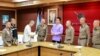 FILE - Chinese actor Wang Xing, third from left, shakes hands with a Thai police officer following his return after being kidnapped into a Myanmar telecom fraud center, at a police station in the Mae Sot district, Thailand, on Jan. 7, 2025. (Royal Thai Police via Reuters)