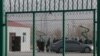 FILE - Residents line up inside a vocational training center in Artux, in western China's Xinjiang region, Dec. 3, 2018. Critics say China uses some of these facilities as detention camps for forced labor. 