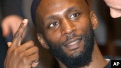 FILE - In this Dec. 17, 2004 photo, Jamal al-Harith, of Britain, a former inmate at Guantanamo Bay, gestures after his testimony to Europe's top human rights body in Paris. The Islamic State group identified Abu Zakariya al-Britani, a suicide bomber who attacked a military base in Iraq last week who was a former Guantanamo Bay detainee freed in 2004. 