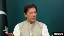 FILE - Pakistan's Prime Minister Imran Khan gestures during an interview with Reuters in Islamabad, Pakistan, June 4, 2021. 